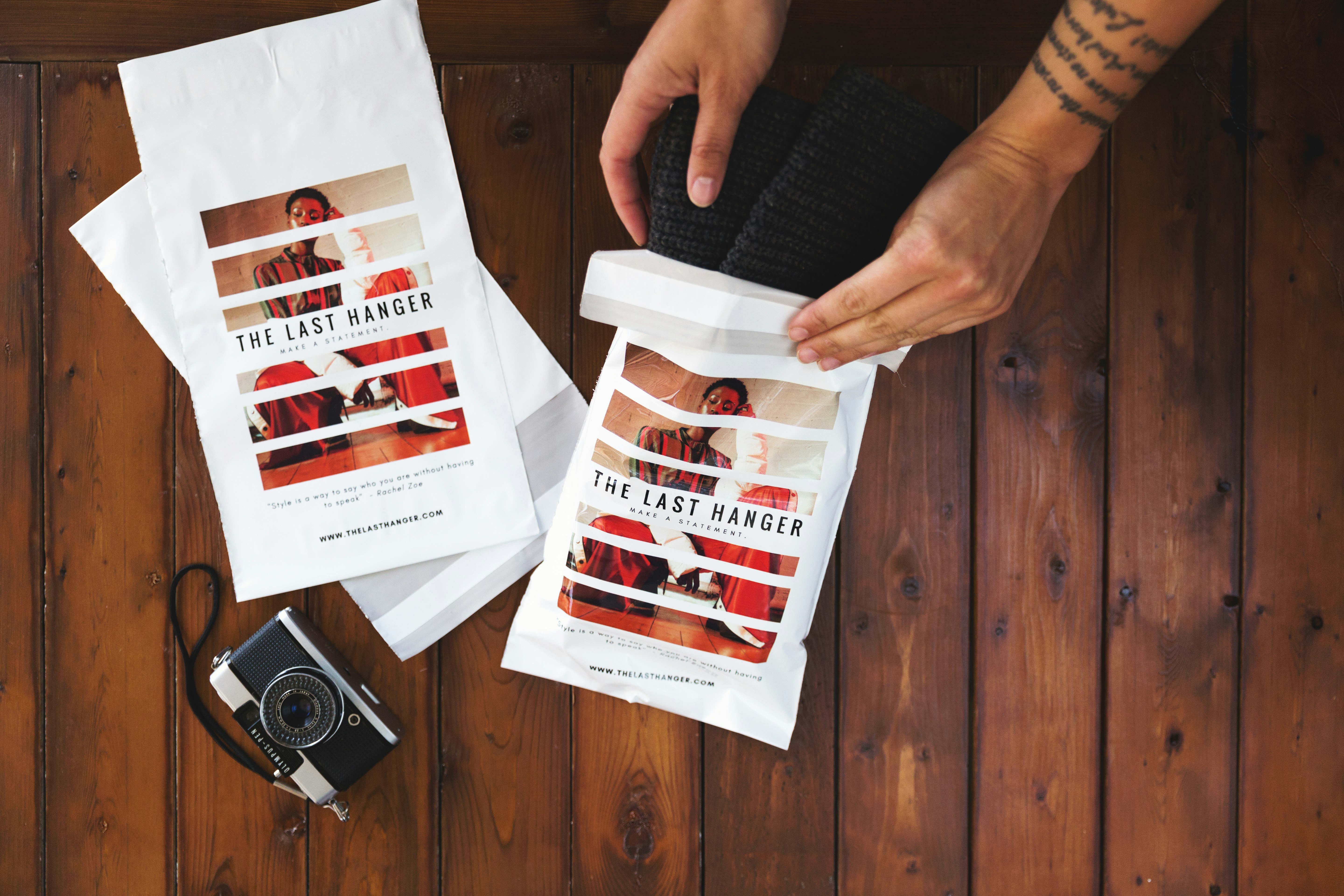 person holding white and red paper